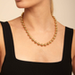 UNO DE 50 Snowflake Gold Short beaded necklace with padlock